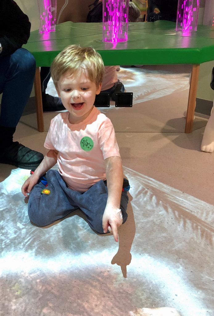 A young boy plays a sensory projector on Ward 10 at the Great North Children's Hospital