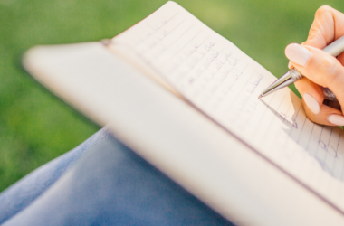 Photo of someone writing in a book